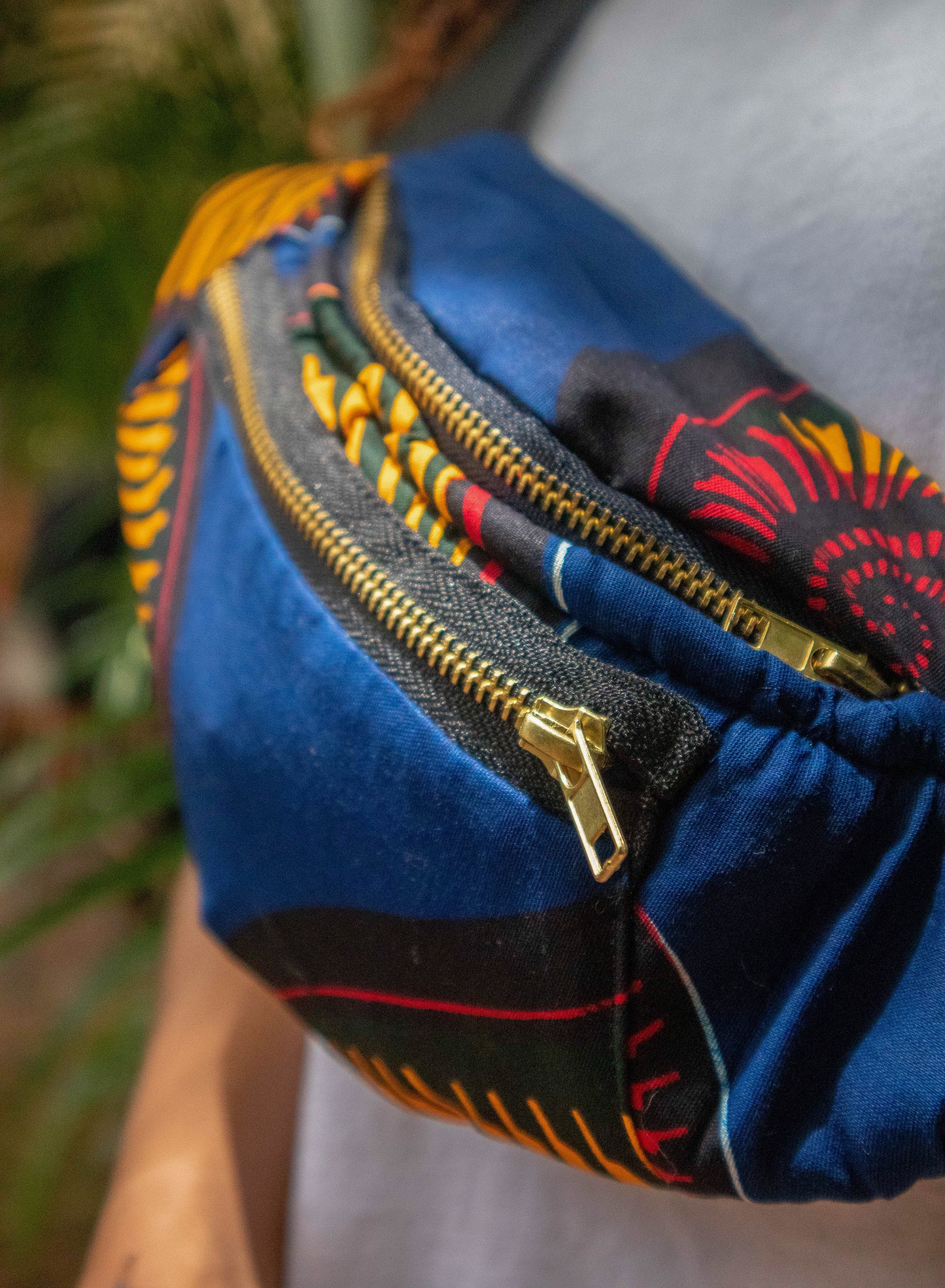 Woman wearing cotton fanny pack at outdoor music festival, hands-free style